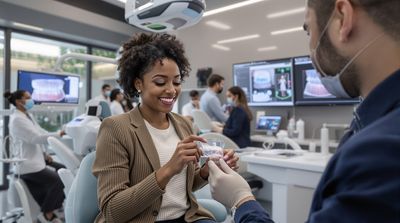 Professional patient examining Invisalign clear aligner trays in modern dental consultation
