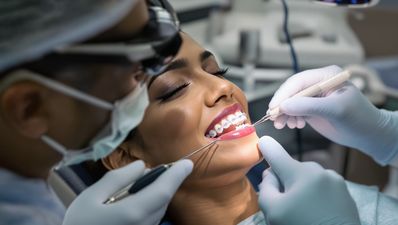 American patient with braces in dental office.
