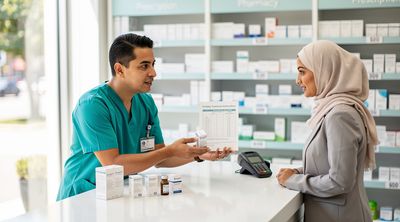 An international patient consulting on affordable fertility medications with a Mexican pharmacist.