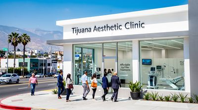 Diverse patients enter a modern Tijuana cosmetic clinic near the US border, emphasizing affordability.